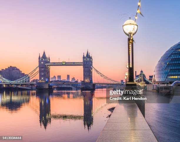 a dawn view of london's tower bridge and the southbank, london - london foto e immagini stock