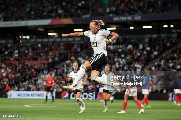 Alexandra Popp of Germany celebrates after scoring her team's first goal during the UEFA Women's Euro England 2022 Semi Final match between Germany...
