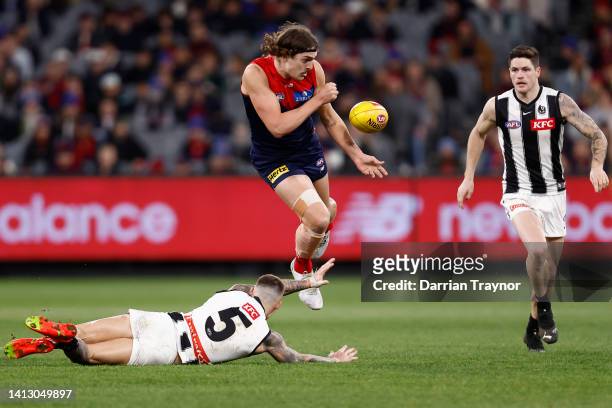 Luke Jackson of the Demons handballs during the round 21 AFL match between the Melbourne Demons and the Collingwood Magpies at Melbourne Cricket...