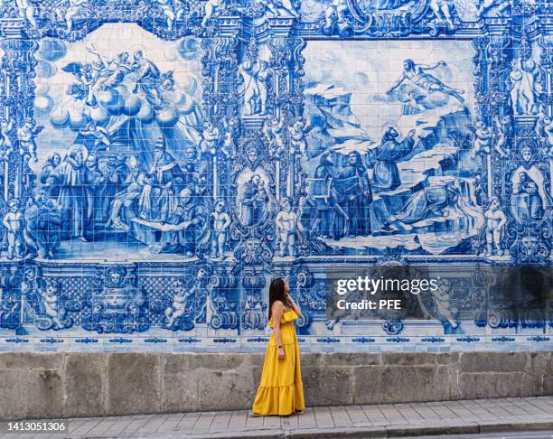 chapel of souls in porto with yellow dressed model - distrito do porto portugal imagens e fotografias de stock