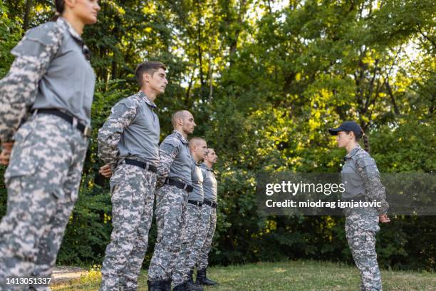 recruits undergo basic training, leaded by the female sergeant - sergeant stock pictures, royalty-free photos & images