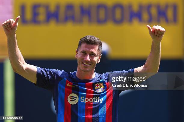 Robert Lewandowski poses for the media as he is presented as a FC Barcelona player at Camp Nou on August 05, 2022 in Barcelona, Spain.