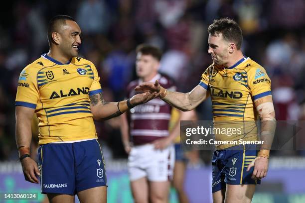 Marata Niukore of the Eels and Clinton Gutherson of the Eels celebrate after winning the round 21 NRL match between the Manly Sea Eagles and the...