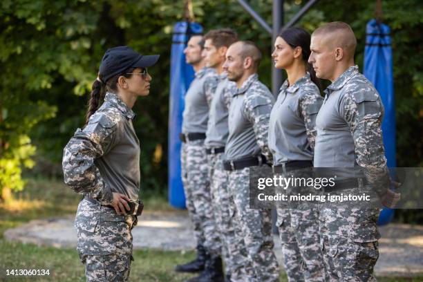 recruits undergo basic training, leaded by the female sergeant - sergeant stock pictures, royalty-free photos & images