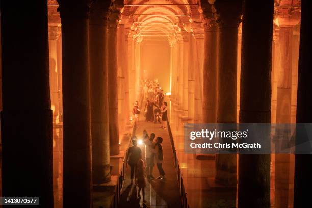 Tourists visit Istanbul's famous Basilica Cistern on August 05, 2022 in Istanbul, Turkey. The historic site recently reopened to the public after...