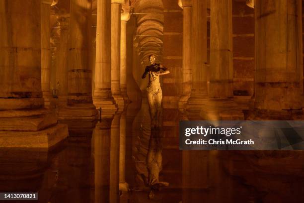 Tourists visit Istanbul's famous Basilica Cistern on August 05, 2022 in Istanbul, Turkey. The historic site recently reopened to the public after...