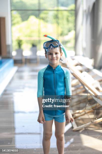 smiling little boy by the swimming pool - kids swimwear stock pictures, royalty-free photos & images