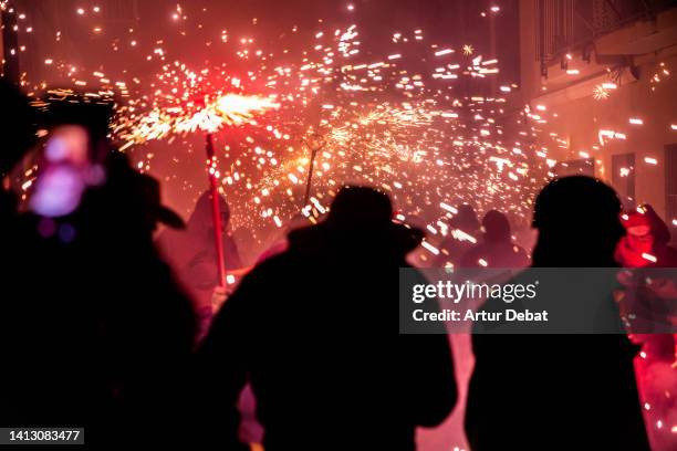 correfocs, fire and sparks celebration in catalonia. - correfoc stockfoto's en -beelden