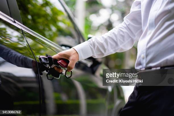 hand unlock the car door. keyless entry system on the modern car - car keys hand ストックフォトと画像