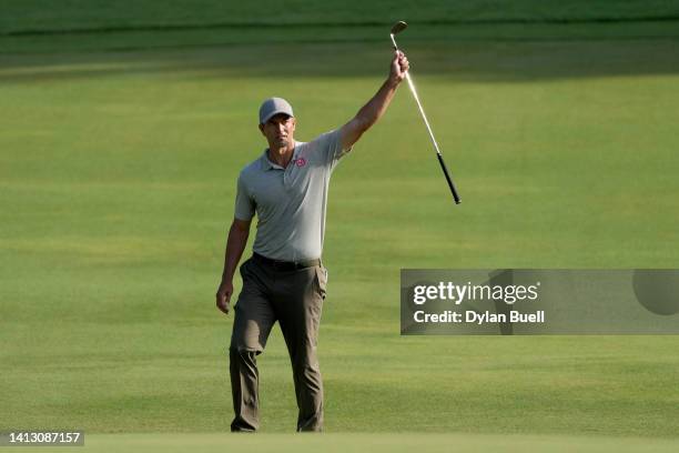 Adam Scott of Australia reacts to his birdie on the 12th green during the second round of the Wyndham Championship at Sedgefield Country Club on...