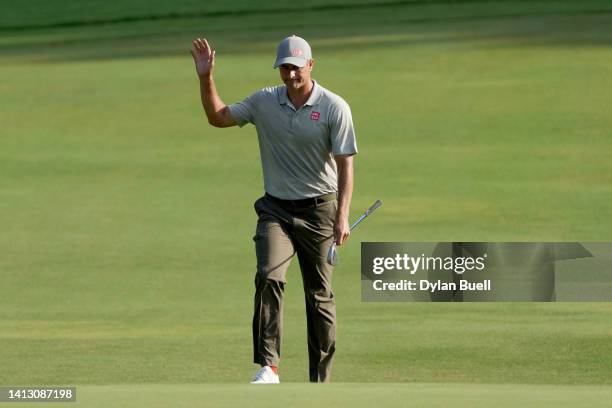 Adam Scott of Australia reacts to his birdie on the 12th green during the second round of the Wyndham Championship at Sedgefield Country Club on...