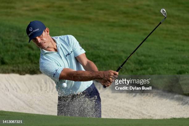 Billy Horschel of the United States plays a shot from a bunker on the 12th hole during the second round of the Wyndham Championship at Sedgefield...