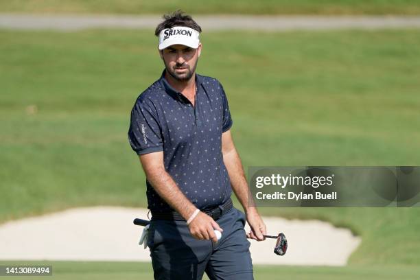 Brett Drewitt of Australia reacts to his birdie putt on the 12th green during the second round of the Wyndham Championship at Sedgefield Country Club...