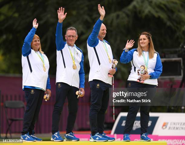 Gold medalists Melanie Inness, George Miller, Robert Barr and Sarah Jane Ewing of Team Scotland pose on the podium during Para Mixed Pairs B2/B3 -...