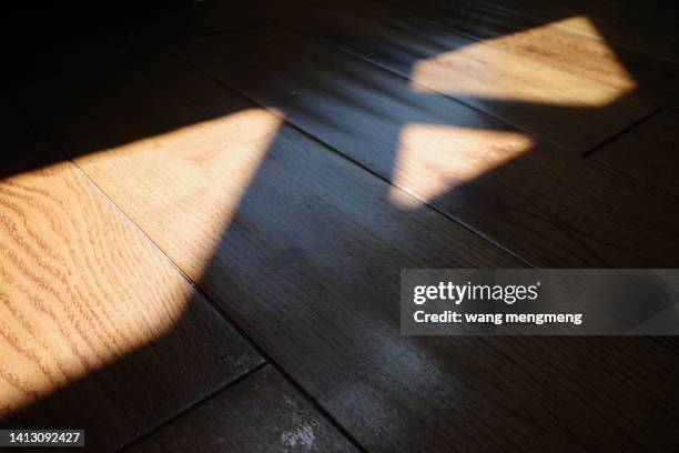 light and shadow of wooden floor - tabla de piso fotografías e imágenes de stock