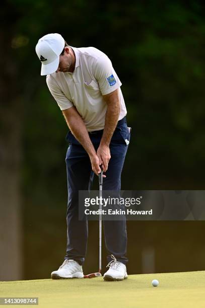 Nick Taylor of Canada putts on the first green during the second round of the Wyndham Championship at Sedgefield Country Club on August 05, 2022 in...
