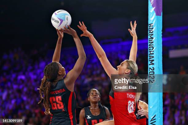 Mwai Kumwenda of Team Malawi competes with Leila Thomas of Team Wales during Netball - Classification 7-8 match between Wales and Malawi on day eight...