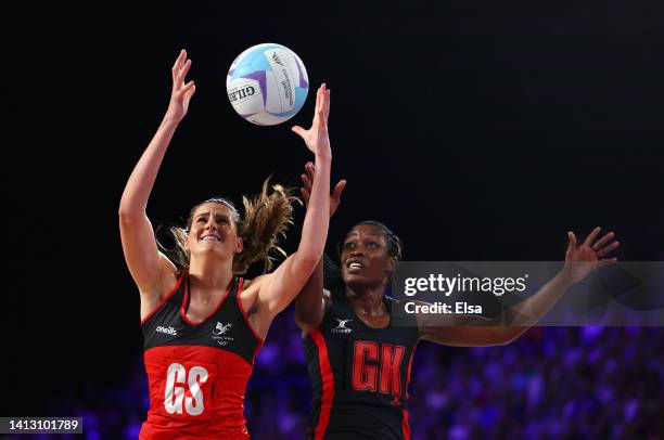 Georgia Rowe of Team Wales catches the ball ahead of Towera Vinkhumbo of Team Malawi during Netball - Classification 7-8 match between Wales and...