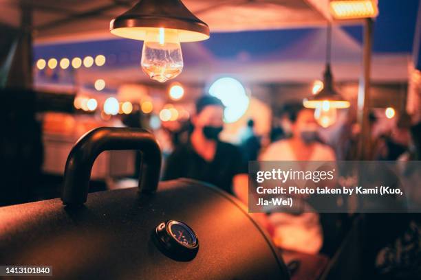 street vendor barbecue grill and light bulbs at night - taiwan night market stock pictures, royalty-free photos & images