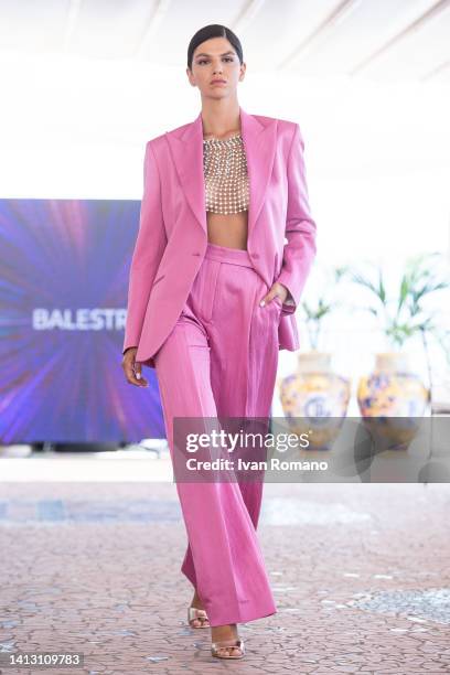 Model walks the runway at the IFTA Evening Show - Intimate Fashion Show on July 20, 2022 in Vietri sul Mare, Italy.