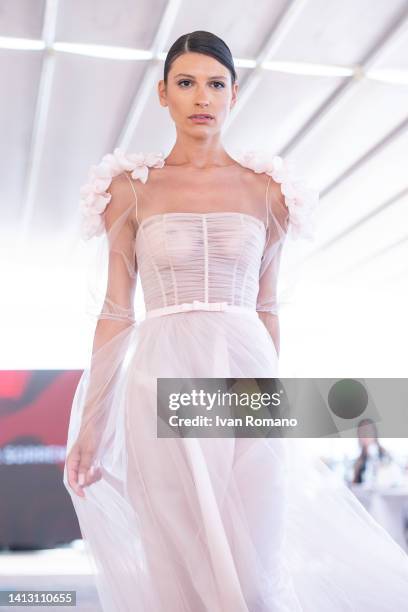 Model walks the runway at the IFTA Evening Show - Intimate Fashion Show on July 20, 2022 in Vietri sul Mare, Italy.