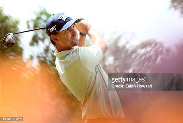 Michael Gligic of Canada plays his shot from the 15th tee during the second round of the Wyndham Championship at Sedgefield Country Club on August...