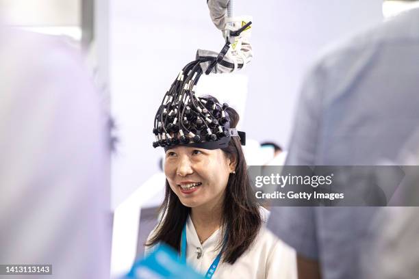 The guest experience medical equipment during the 2022 World Health Expo held in Wuhan International Expo Center on August 5,2022 in Wuhan, Hubei...