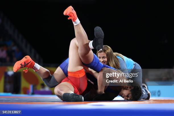 Sakshi Malik of Team India pins Ana Godinez Gonzalez of Team Canada during the Women's Freestyle 62 kg Gold Medal match on day eight of the...