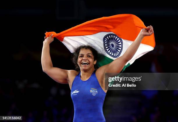Sakshi Malik of Team India celebrates after defeating Ana Godinez Gonzalez of Team Canada during the Women's Freestyle 62 kg Gold Medal match on day...