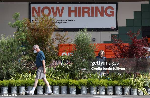 Now hiring" sign is posted at a Home Depot store on August 05, 2022 in San Rafael, California. According to data released by the Bureau of Labor...