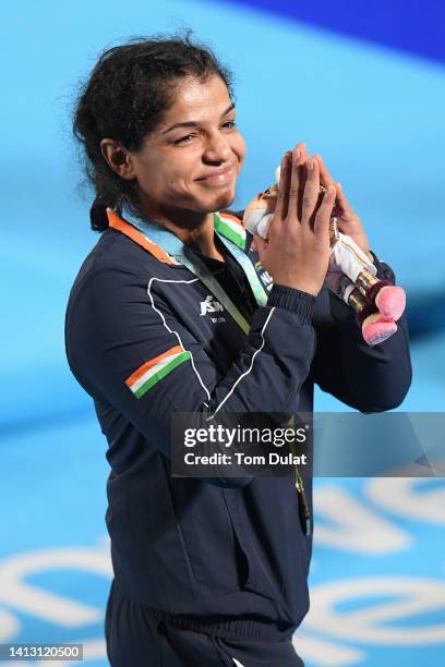 Gold medalist Sakshi Malik of Team India celebrates during the Women's Freestyle Wrestling 62 kg medal ceremony on day eight of the Birmingham 2022...