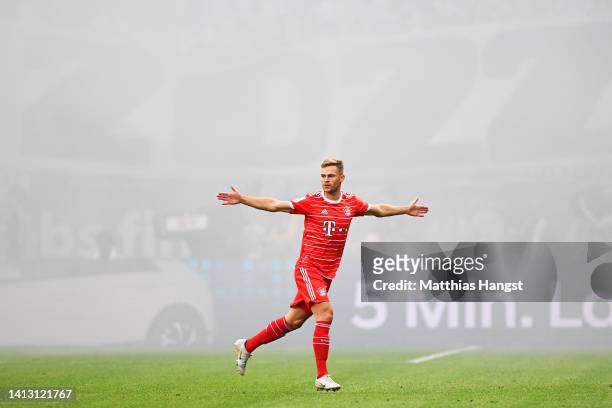 Joshua Kimmich of Bayern Munich celebrates scoring their side's first goal during the Bundesliga match between Eintracht Frankfurt and FC Bayern...