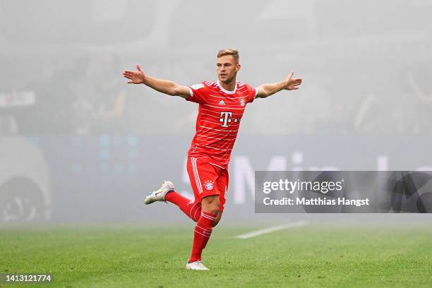 Joshua Kimmich of Bayern Munich celebrates scoring their side's first goal during the Bundesliga match between Eintracht Frankfurt and FC Bayern...