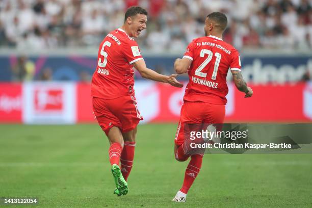 Benjamin Pavard of Bayern Munich celebrates scoring their side's second goal with teammate Lucas Hernandez during the Bundesliga match between...