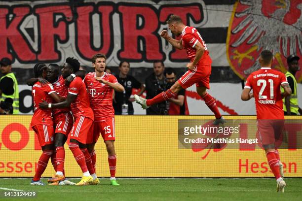 Sadio Mane of Bayern Munich celebrates scoring their side's third goal with teammates during the Bundesliga match between Eintracht Frankfurt and FC...