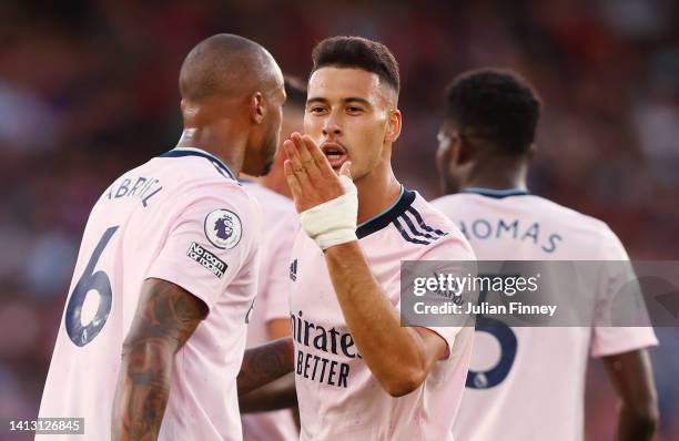 Gabriel Martinelli of Arsenal celebrates scoring their side's first goal with teammate Gabriel Magalhaes during the Premier League match between...