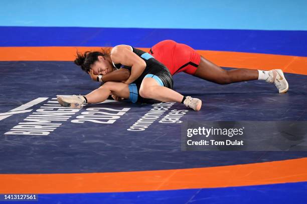 Tayla Ford of Team New Zealand competes against Amylee Sephora Aza of Team Mauritius during the Women's Freestyle 68 kg Bronze Medal on day eight of...