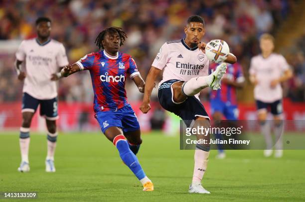 Eberechi Eze of Crystal Palace challenges William Saliba of Arsenal during the Premier League match between Crystal Palace and Arsenal FC at Selhurst...