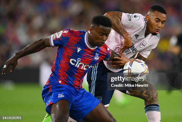 Marc Guehi of Crystal Palace is challenged by Gabriel Jesus of Arsenal during the Premier League match between Crystal Palace and Arsenal FC at...