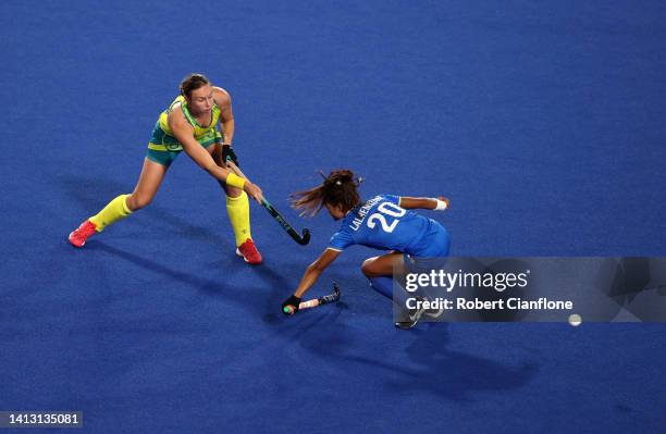 Renee Taylor of Team Australia battles for the ball with Lalremsiami of Team India during the Women's Hockey Semi-Final match between Team Australia...