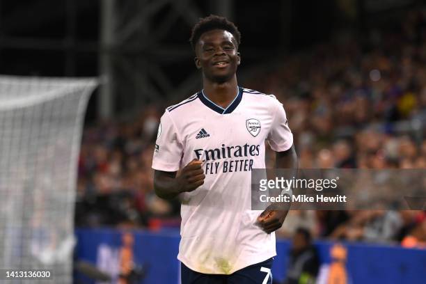 Bukayo Saka of Arsenal celebrates their side's second goal, after Marc Guehi of Crystal Palace concedes an own goal, during the Premier League match...