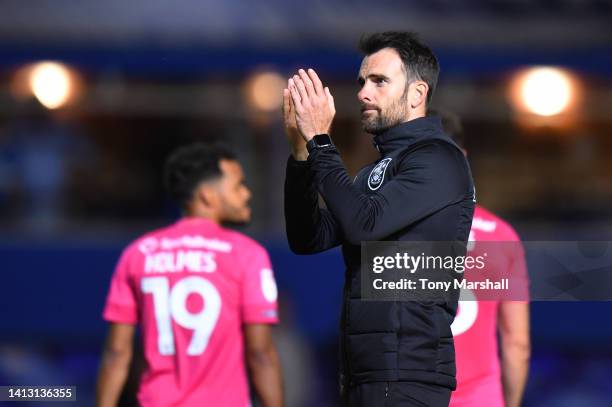 Danny Schofield, Head Coach of Huddersfield Town, applauds their fans after the final whistle of the Sky Bet Championship between Birmingham City and...