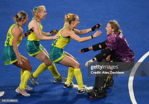 Jocelyn Bartram of Team Australia is congratulated by teammates following victory in the Women's Hockey Semi-Final match between Team Australia and...