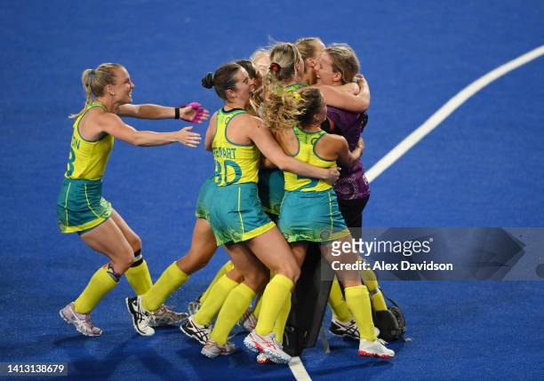 Jocelyn Bartram of Team Australia is congratulated by teammates following victory in the Women's Hockey Semi-Final match between Team Australia and...