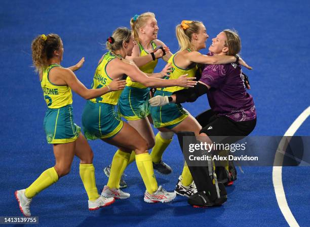 Jocelyn Bartram of Team Australia is congratulated by teammates following victory in the Women's Hockey Semi-Final match between Team Australia and...