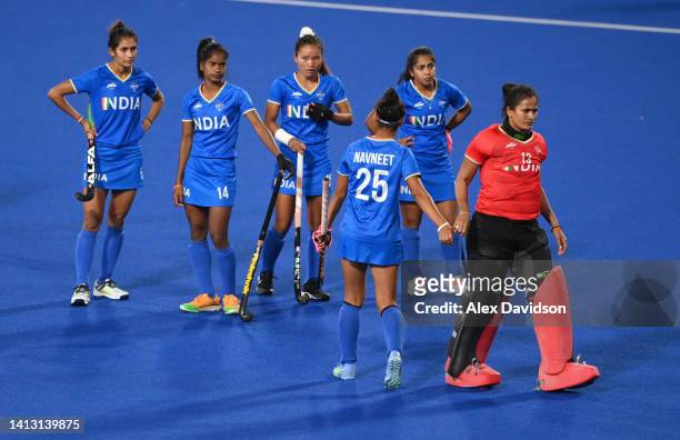 Rajani Etimarpu of Team India looks dejected with teammates following defeat in the Women's Hockey Semi-Final match between Team Australia and Team...
