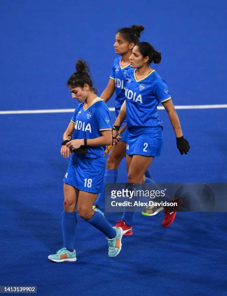 Udita of Team India looks dejected with teammates following defeat in the Women's Hockey Semi-Final match between Team Australia and Team India on...
