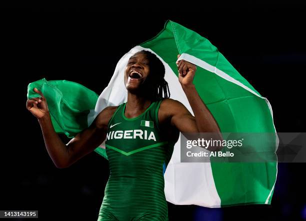 Odunayo Folasade Adekuoroye of Team Nigeria celebrates after defeating Anshu Malik of Team India in the Women's Freestyle Wrestling 57 kg Gold Medal...
