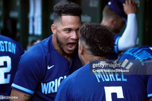 Willson Contreras of the Chicago Cubs reacts in the dugout with Christopher Morel of the Chicago Cubs following a two-run home run during the eighth...