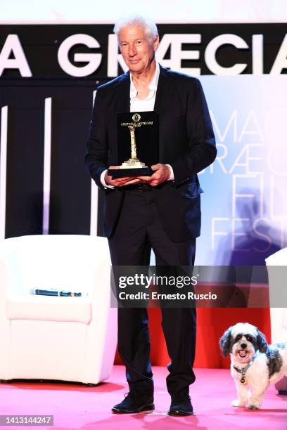 Richard Gere pose with the prize during the Magna Graecia Film Festival 2022 at Arena on August 05, 2022 in Catanzaro, Italy.